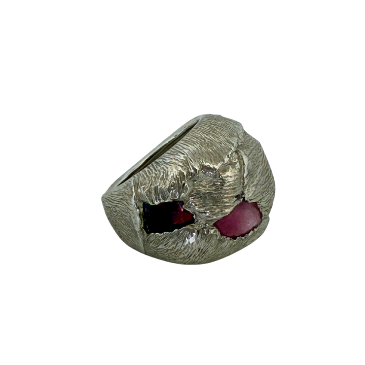 Silver ring with a red gemstone & pink gemstone, both are rubies, on a white background
