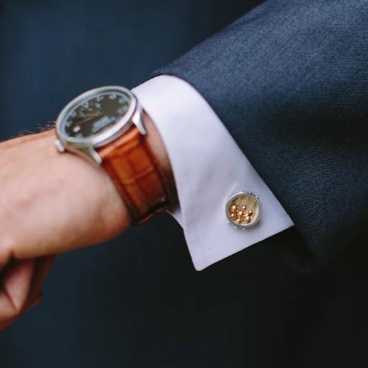 Full view of Round Abacus Cufflinks on a man's suit to give idea of scale of piece.