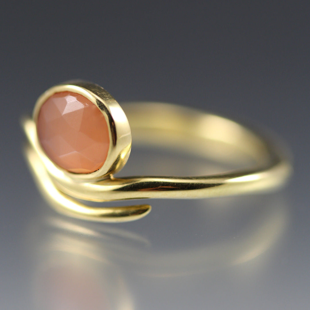 Angled view of Peach Moonstone Wave Ring.