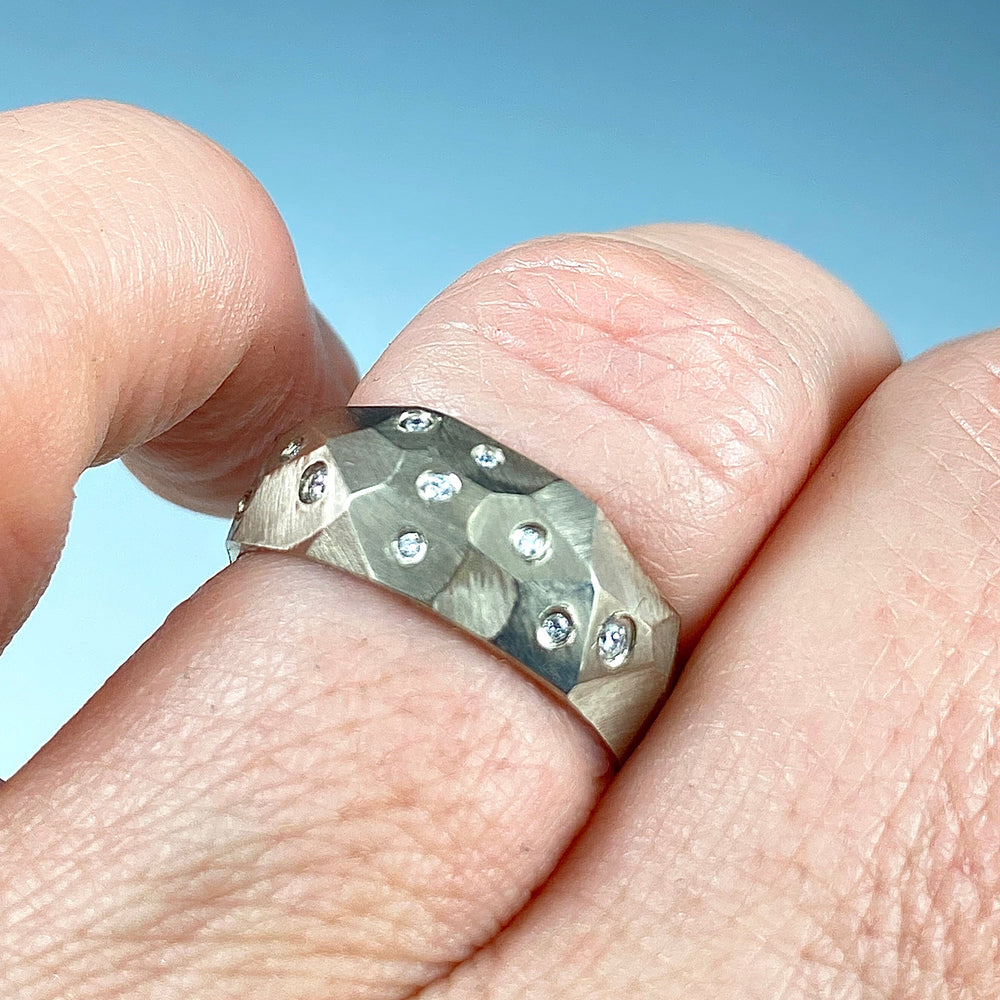 Full view of faceted Dome Ring with Diamond on finger to give a sense of scale of piece.