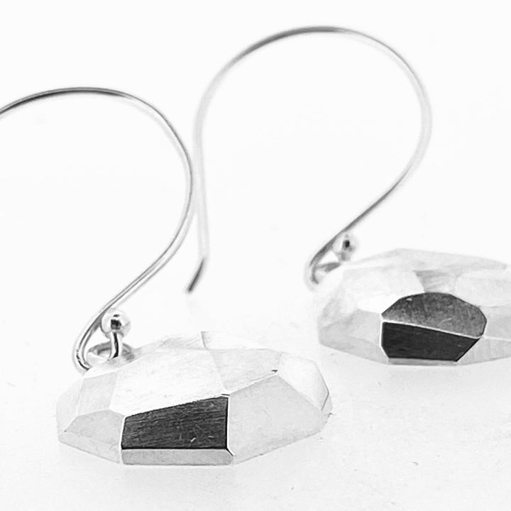 Detail shot of Faceted Dangle earrings.