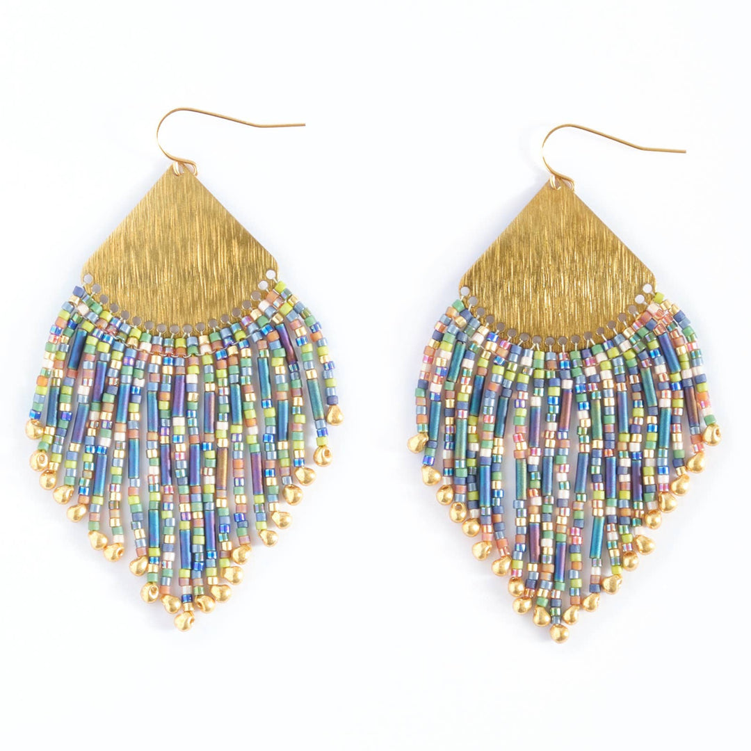 Pair of beaded earrings with gold fringe on a white background