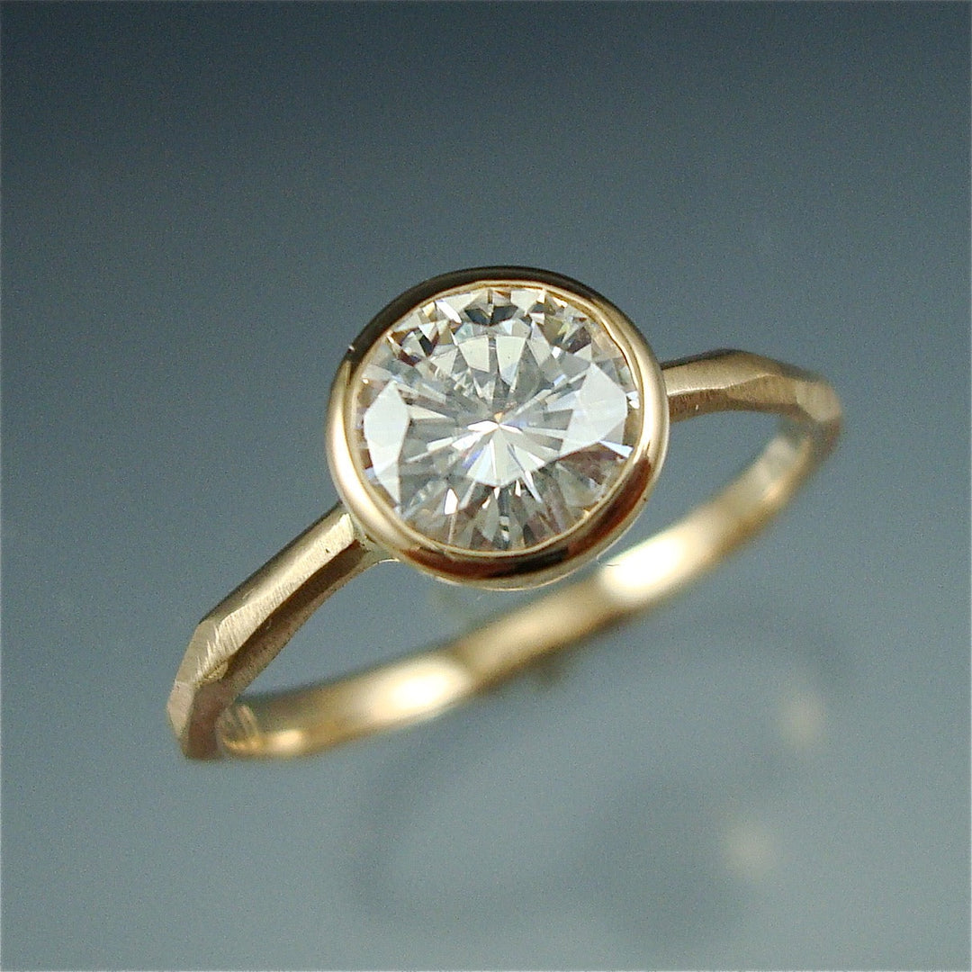 Detail shot of diamond on yellow gold Thin faceted Engagement Ring.