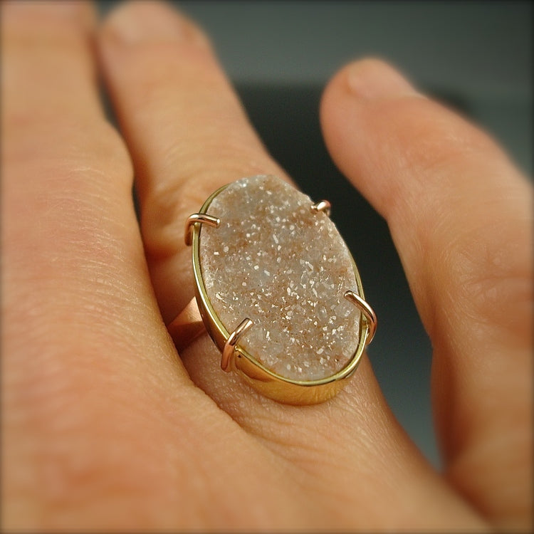 Full image of Peach Druzy Chiseled Ring on woman's hand to give idea of scale of piece.