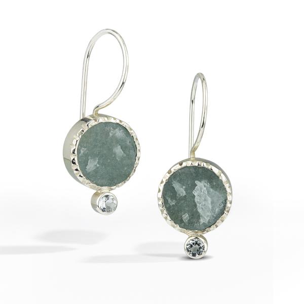 French wire earrings with round raw surface aquamarine gemstone is accented with a small pale blue topaz.