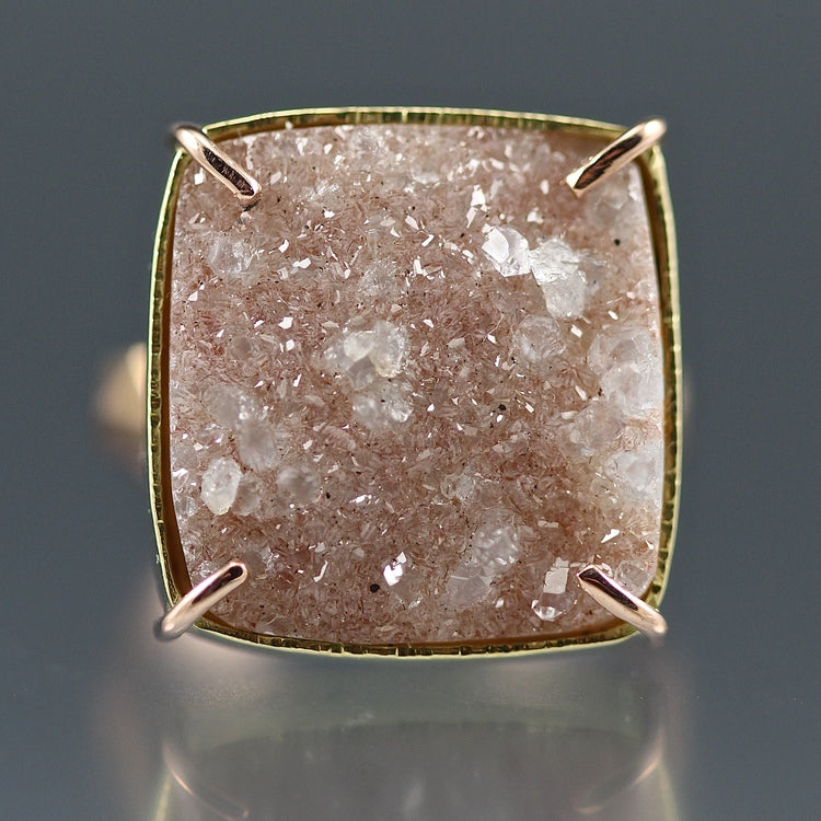 Detail shot of gem on peach Druzy Chiseled Ring #3. Here you can see the raw nature of the gem and all its crystals.