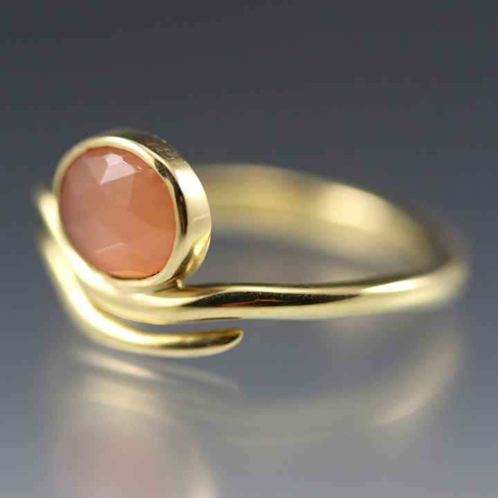 Angled view of Peach Moonstone Wave Ring.