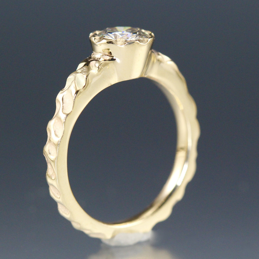 Angled view of Moissanite Cobblestone Engagement Ring standing up, showcasing its side profile.