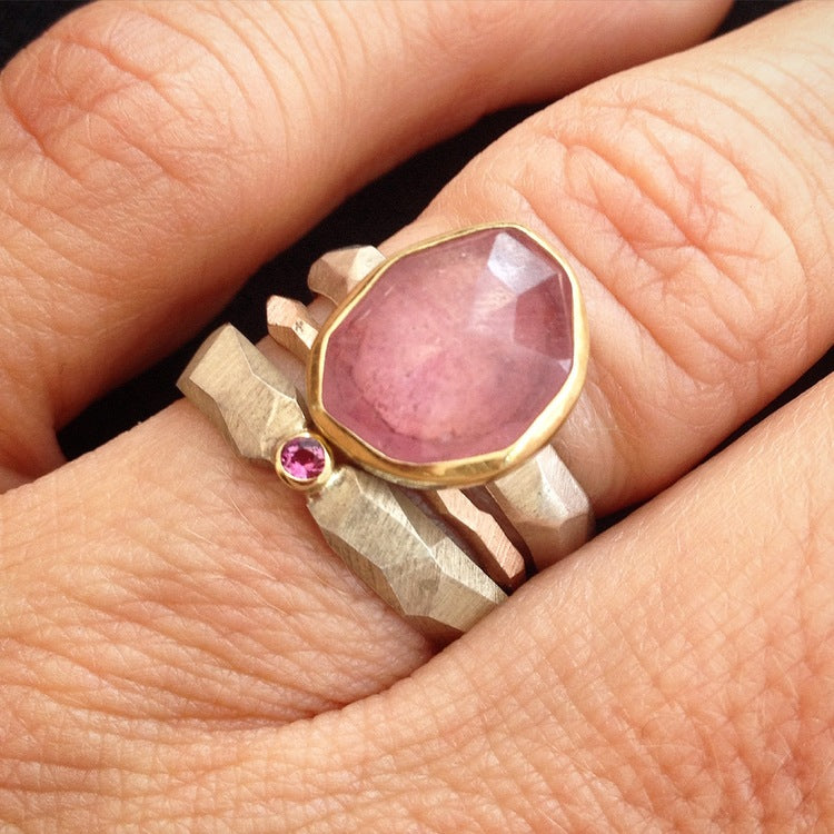 Full view of Rose Cut Pink Sapphire Chiseled Ring and two others stacked on top of each other on a woman's hand to help give idea of scale of piece.