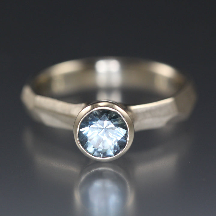 Full image of Montana Blue sapphire Chiseled Ring laying on its side, showcasing its sapphire gemstone.
