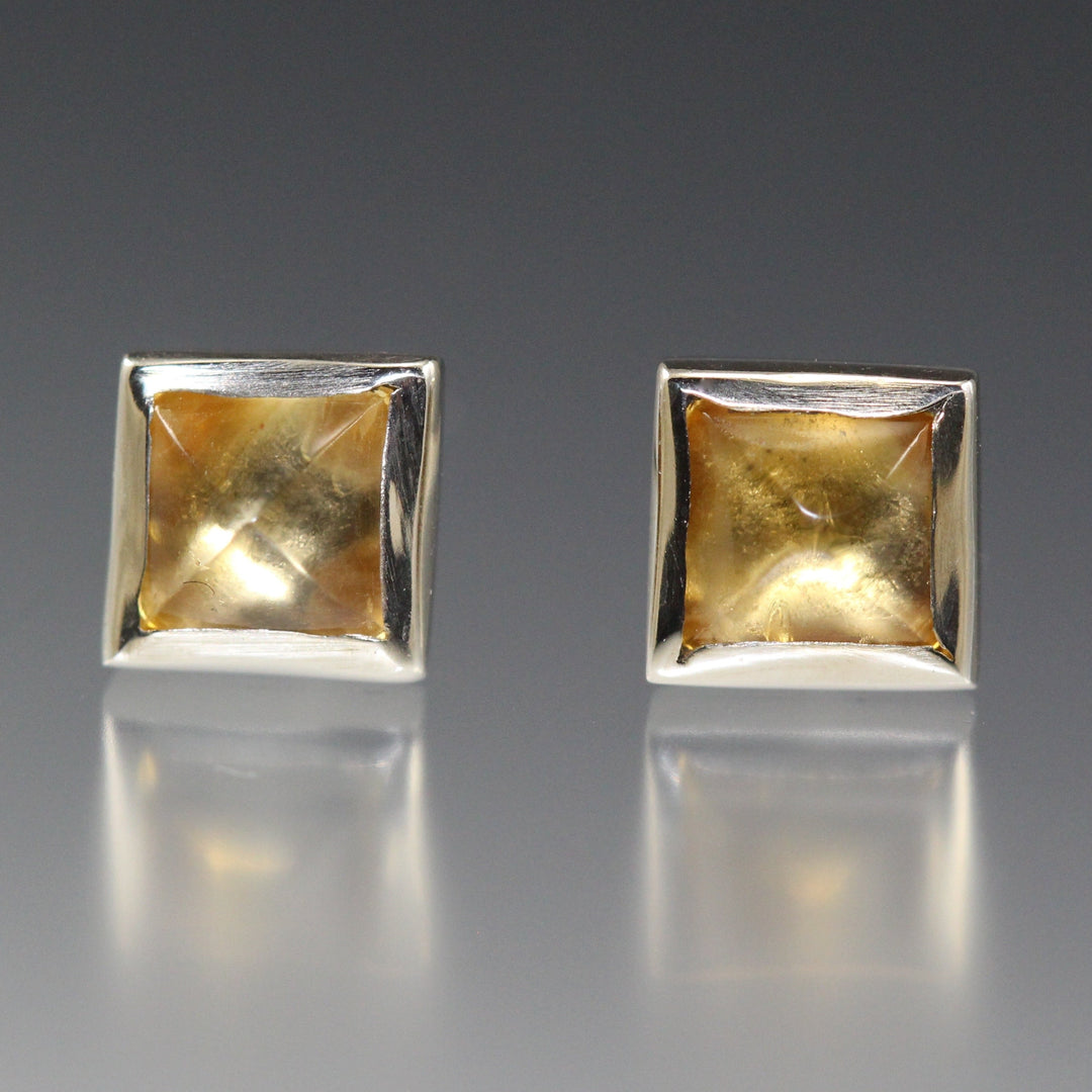 Full view of Square Stud Earrings - Citrine. these stud earrings have a set citrine cabochon in the shape of a square and set in silver.