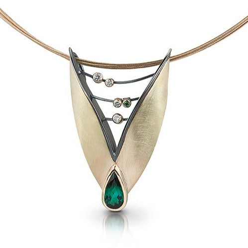 Full image of pendant on Butterfly Glider Brooch/Necklace. This pendant is in the shape of an abstracted butterfly with teardrop of green tourmaline set at the bottom and lines connecting the wings with set diamonds on them.