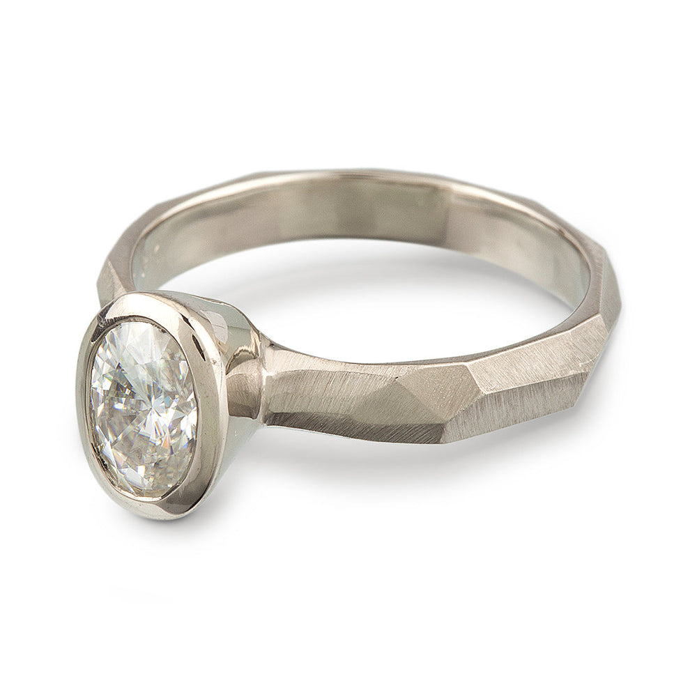 Bezel Set Oval Engagement Ring featuring a organic faceted band in 14k white gold