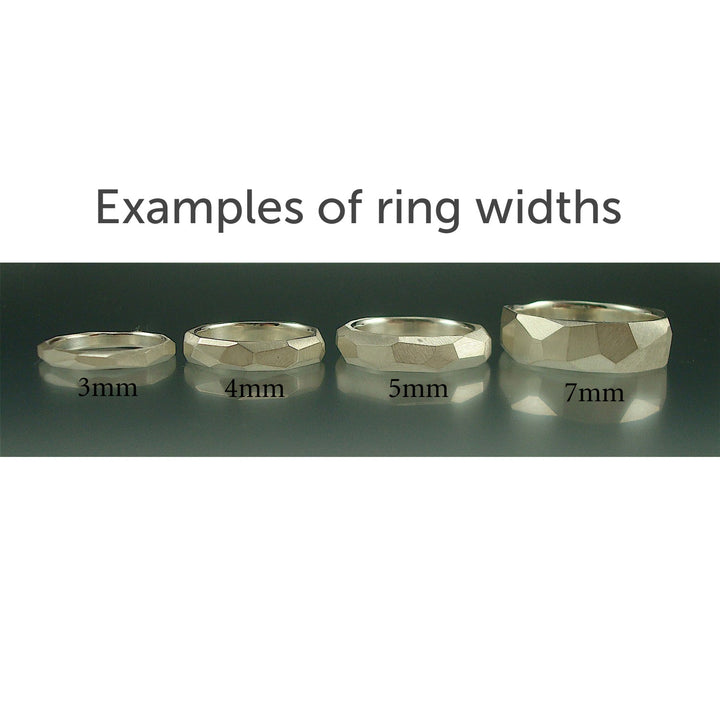 Full view of four different sized (3mm, 4mm, 5mm, and 7mm) silver Women's facet Rings sitting right next to one another.