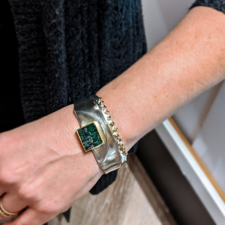 Full view of Green Tourmaline and Fancy Colored Sapphire - Ridge Cuff on arm to give a sense of scale of piece.