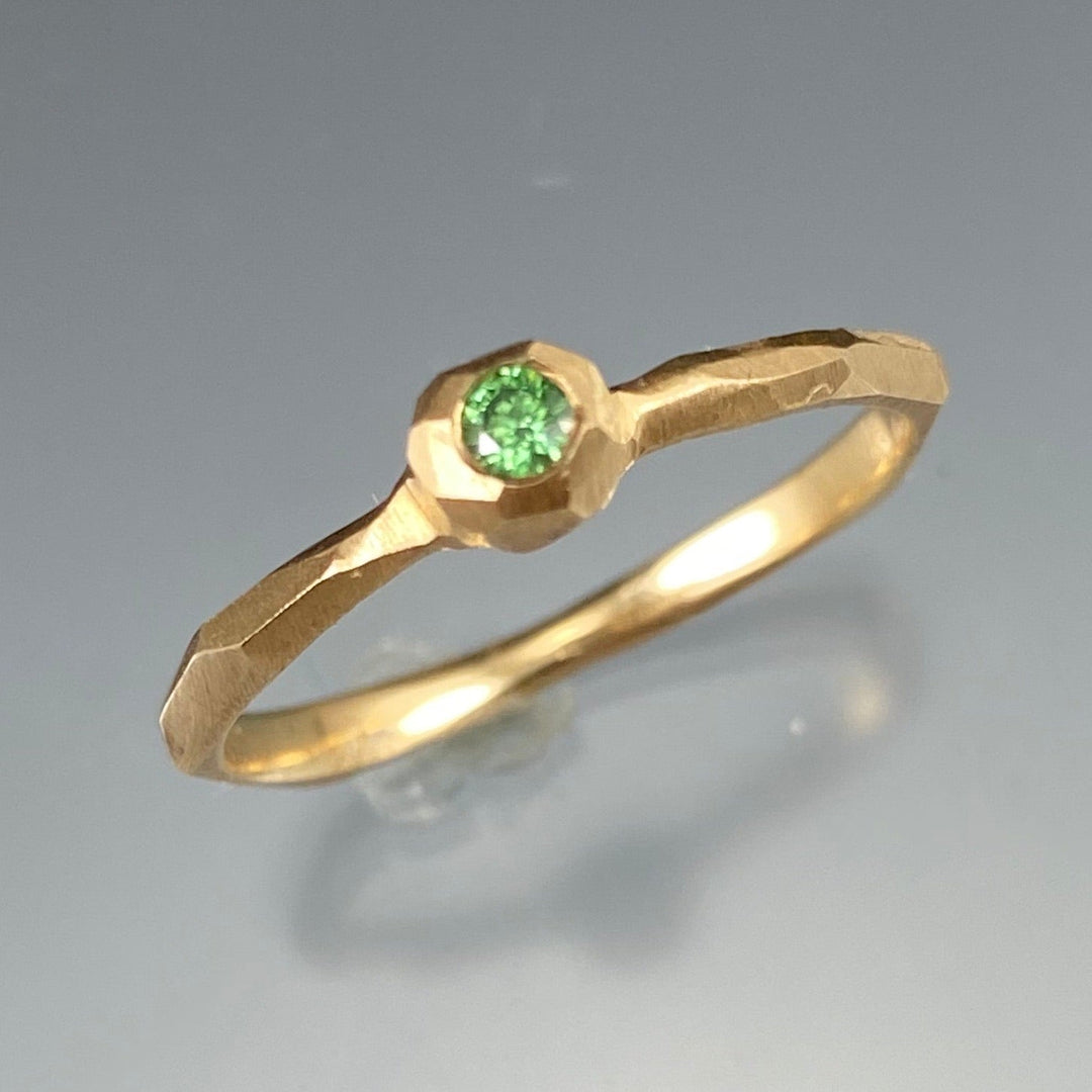 Top view of green diamond nugget facet ring.
