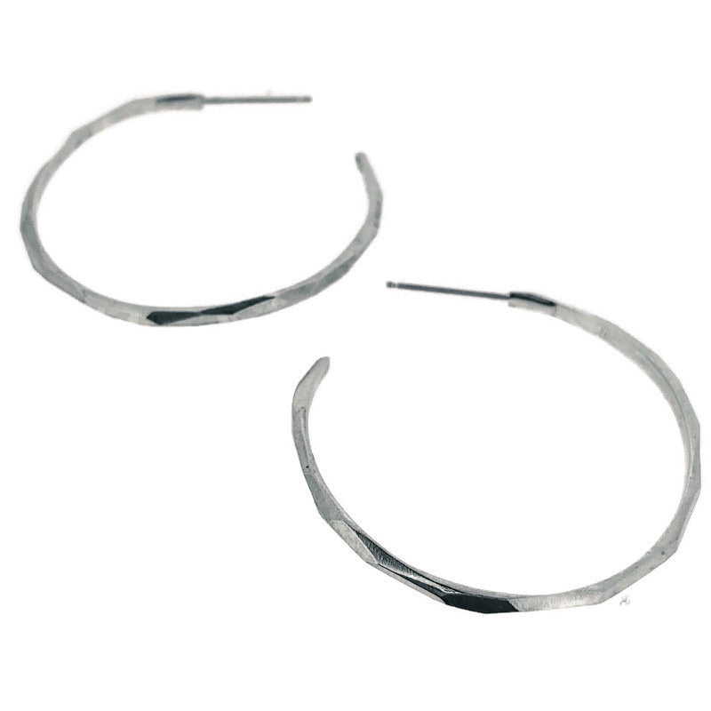 Full view of medium faceted hoop earrings.