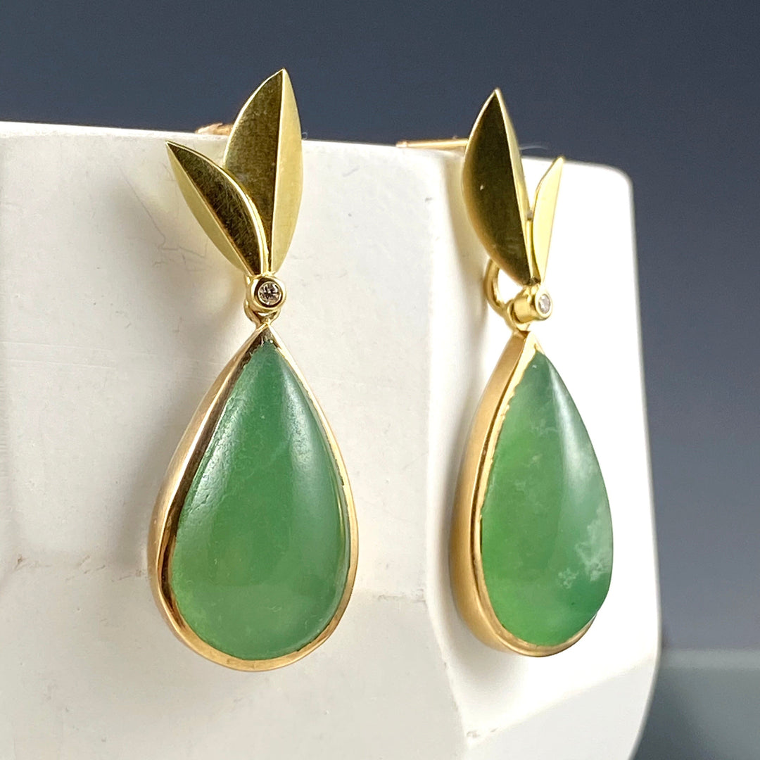 Angled view of Chrysoprase - Convertible Bloom Earrings hanging from white cup.