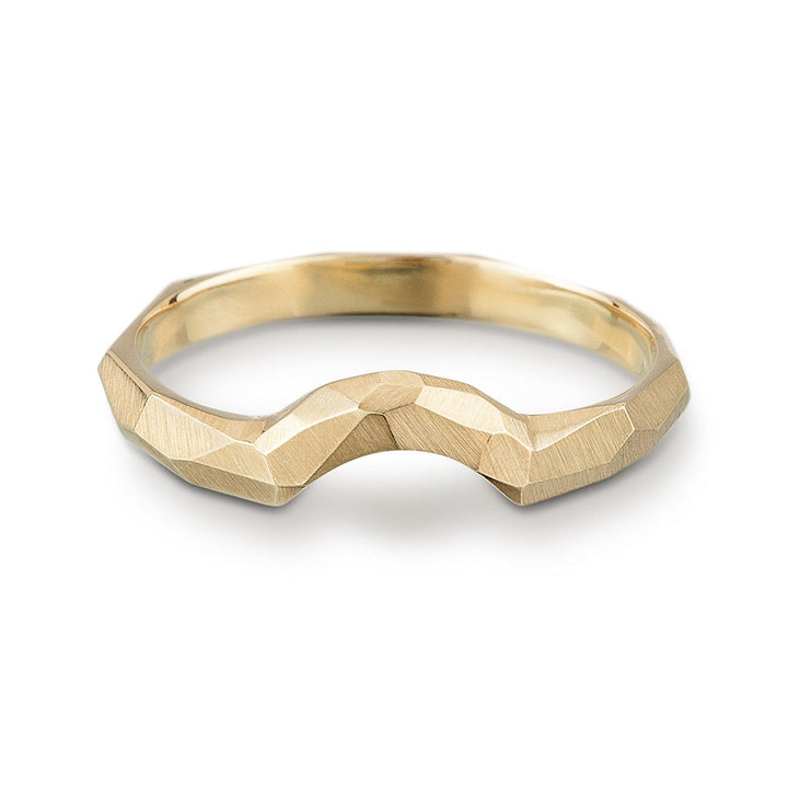 Full image of Contoured facet Ring. This ring is made of gold, showcases an arch and has a facet texture.