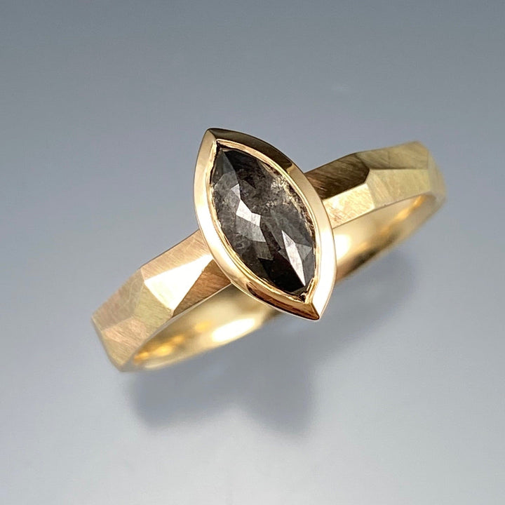 Full view of Salt and Pepper Marquise Rustic Diamond Ring. This ring has a salt and peper colors diamond in the shape of a marquise set in yellow gold on a yellow gold chiseled band.