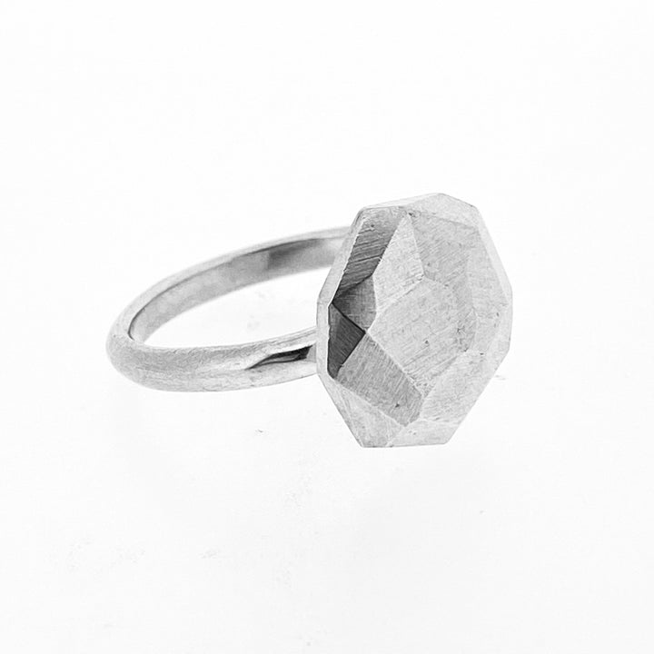 Angled view of faceted large Dome Ring.