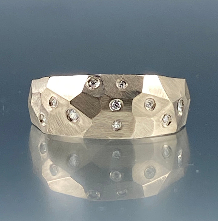 Full view of front of faceted dome ring with diamonds.