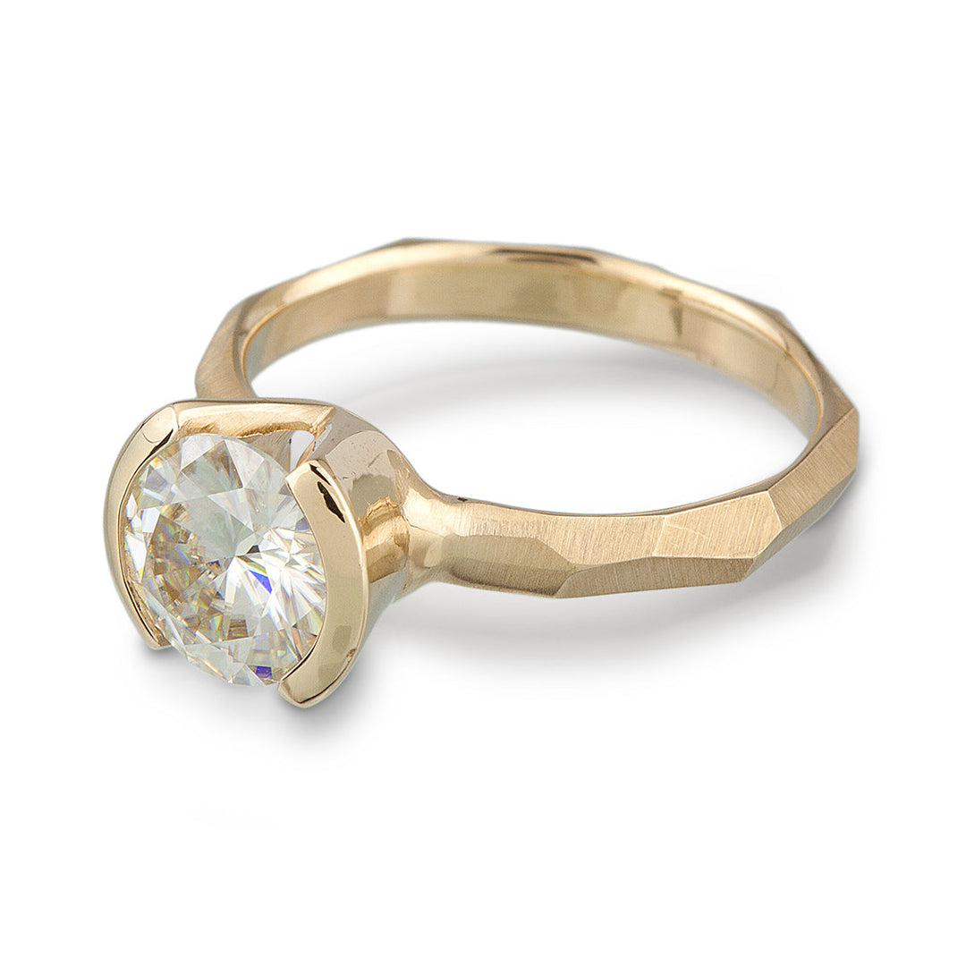 Modern 14k yellow gold Engagement Ring with a Partial Bezel containing a Moissanite Stone 